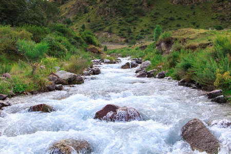 mountain river among green mountains. summer landscape. Kegeti Gorge, Kyrgyzstan.の写真素材