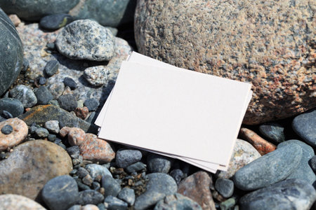 Blank business card mockup on a background of stones. Blank white business card mockup for your...