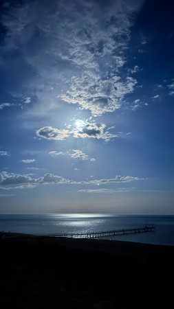 Moon over the lake. Full moon in the clouds. Kyrgyzstan, Lake Issyk-Kulの写真素材