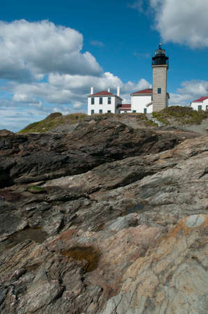 Historic Beavertail lighthouse is built above unique rock formations, near Newport, Rhode Island.のeditorial素材