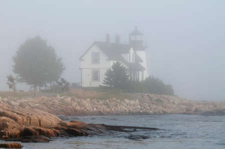 Maine's Prospect Harbor lighthouse guides mariners during foggy weather.の写真素材