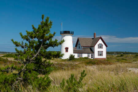 Headless lighthouse of Cape Cod on a warm summer day. Stage Harbor lighthouse is the only beacon without its lantern in New England.の写真素材