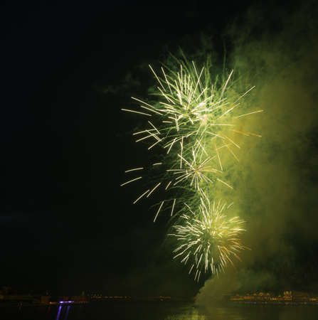 night city green fireworksの写真素材
