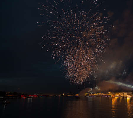 night city celebration holiday bright firework above river long exposure shootの写真素材