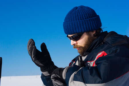 portrait of handsome skier in the snowy fieldの写真素材