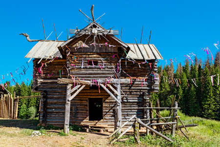 Old traditional Udmurt wooden house near the forestの写真素材