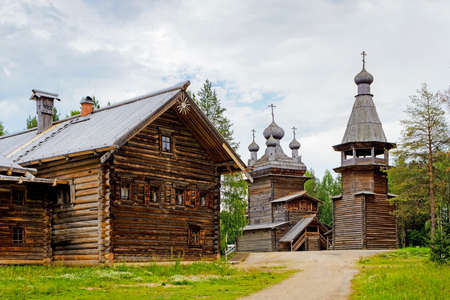 Old wooden Ascension Church belfry and house in the reserve Malye Korelyの写真素材