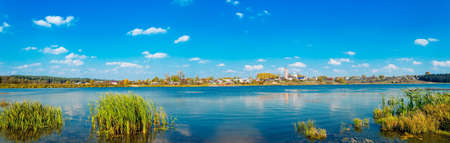 Russian village Sredneivkino with a church at the autumnの写真素材
