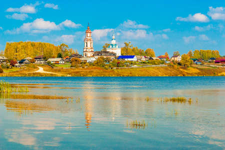 Russian village Sredneivkino with a church at the autumnの写真素材