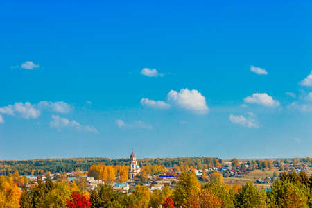 Russian village Sredneivkino with a church in the autumnの写真素材