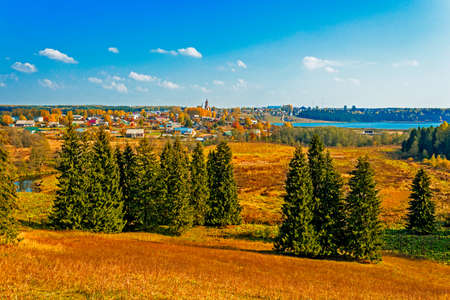 Russian village Sredneivkino with a church in the autumnの写真素材