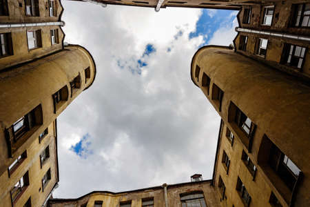 View up at the sky from the courtyard in Saint Petersburgの写真素材
