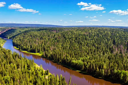 View of the northern spruce forest and river from above. Russiaの写真素材