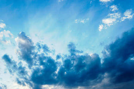Beauty evening sky with white and dark cloudsの写真素材