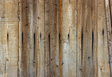 Close-up of the wall of the old gray planks