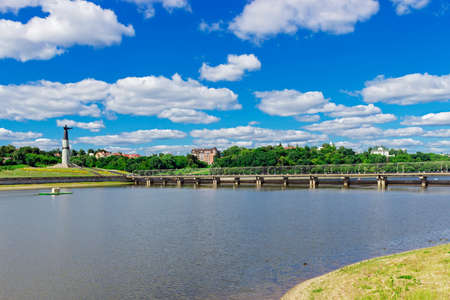 View of the embankment, pedestrian bridge and statue in Cheboksary. Russiaの写真素材