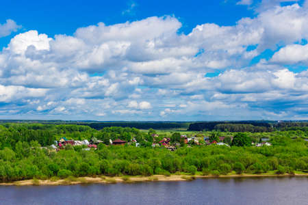 Russian village on the river on a summer dayの写真素材