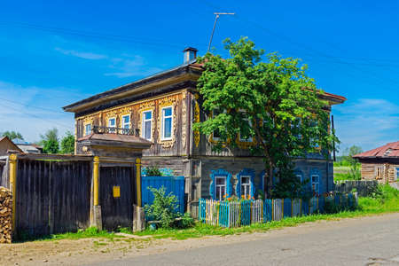 old wooden house in the village on a summer dayの写真素材