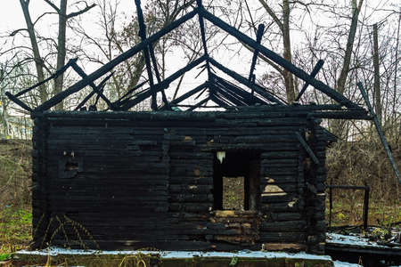 ruins of a burnt wooden house after a fireの写真素材