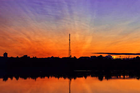 river and tower at sunset on a summer evening
