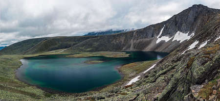 landscape mountain lake on cloudy summer day