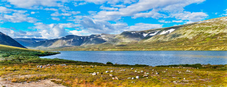 Lake and mountain range in the Subpolar Urals on a summer dayの写真素材