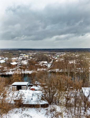 View from the hill to the outskirts of a Russian city on a gloomy winter dayの写真素材
