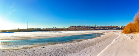 View of the city of Kirov from the opposite bank of the Vyatka River on a frosty winter dayの写真素材