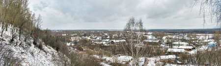 View from the hill to the outskirts of a Russian city on a gloomy winter dayの写真素材