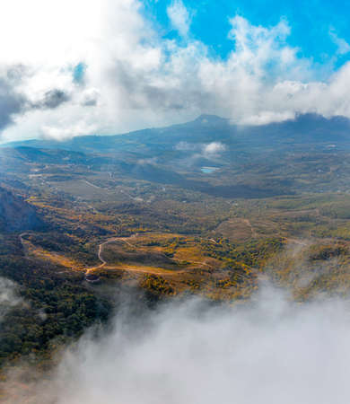 View from the mountain to the landscape of Crimea on an autumn dayの写真素材