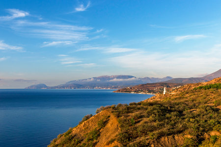 View of the sea, mountains and coastal villages in Crimea on a summer morningの写真素材