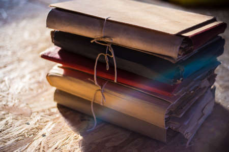 Stack of old documentation records in fiber folders in sunlightの写真素材