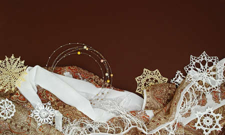 background with different jewelries, knitted snowflakes and textileの写真素材