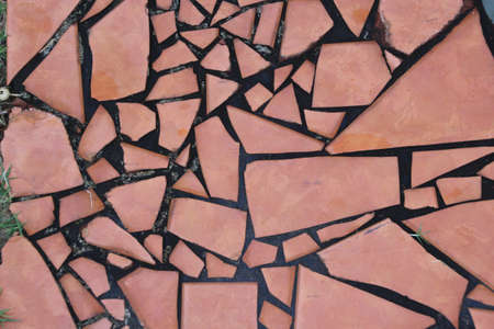  Abstract ceramic cracked tile design in pink and blackの写真素材