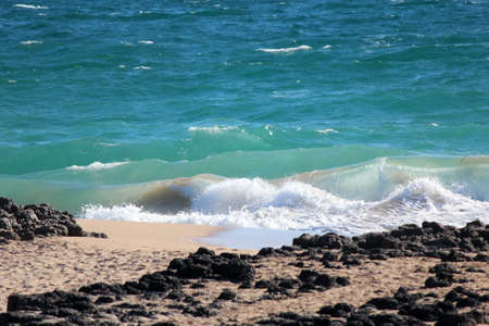Indian Ocean waves  breaking on basalt rocks  at Bunbury south western Australiaの写真素材