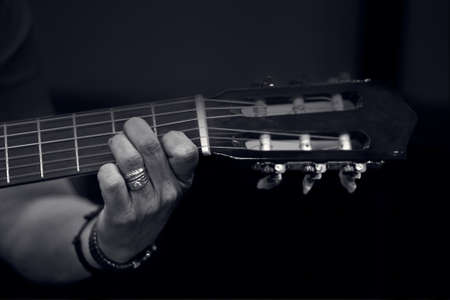 close-up of a woman hand playing the guitar
