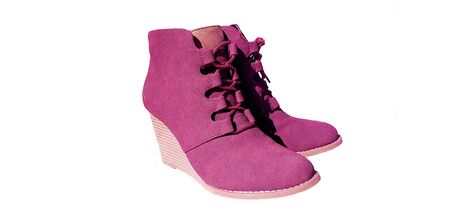 Female violet suede boots on grey background, isolated productの写真素材