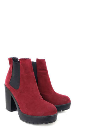 Female dark red suede boots on white background, isolated product, top view. heeled shoesのeditorial素材