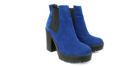 Female blue suede boots on white background, isolated product, top view. heeled shoesの写真素材