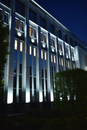 backlit administrative building at night, photo of searchlights, building lighting, night illuminationの写真素材