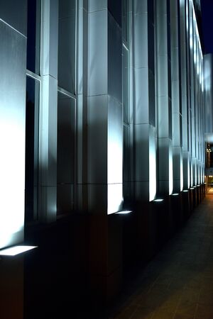 backlit administrative building at night, photo of searchlights, building lighting, night illuminationの写真素材