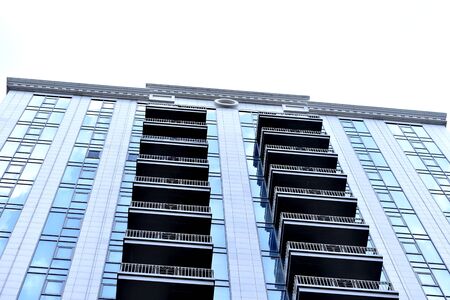 Modern, new executive apartments and with deep blue summer skyの写真素材