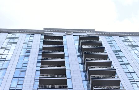 Modern, new executive apartments and with deep blue summer skyの写真素材