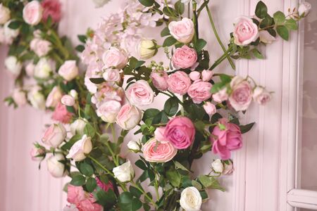 Lilac, roses and tulips background isolated on pinkの写真素材