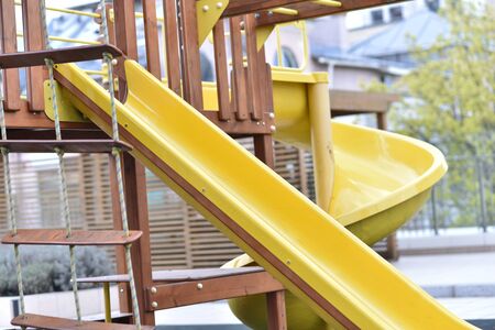 The yellow ladder for lifting on a children's slide