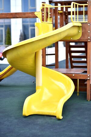 The yellow ladder for lifting on a children's slideの写真素材