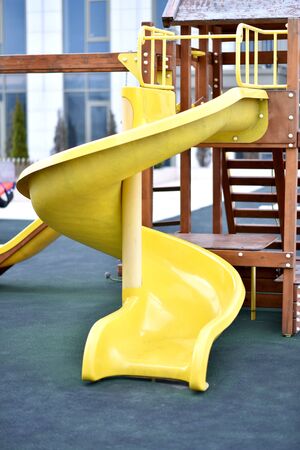 The yellow ladder for lifting on a children's slideの写真素材