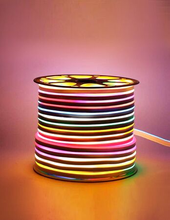 Flexible led tape neon flex in different colors on black backgroundの写真素材