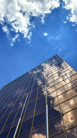 modern facades with blue sky and white clouds on backgroundの写真素材