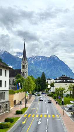 Scenic Alpine Town Vaduz with Church and Majestic Mountains, Liechtenstein 13.05.2024 15:00のeditorial素材